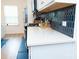 Modern kitchen featuring white countertops, blue backsplash, and stainless steel appliances at 10100 Jack Nicklaus Dr, Lancaster, SC 29720