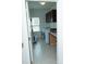 Functional laundry room featuring white washer and dryer, storage cabinets, and tiled flooring at 10100 Jack Nicklaus Dr, Lancaster, SC 29720