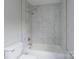 Bathroom featuring a tub, a shower head, and tiled walls at 1013 Doby Springs Dr, Charlotte, NC 28262