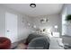 Cozy staged bedroom featuring decorative wall art, modern lighting, and neutral colors at 1013 Doby Springs Dr, Charlotte, NC 28262