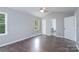 Large bedroom featuring hardwood floors, natural light and ensuite bathroom at 1013 Doby Springs Dr, Charlotte, NC 28262
