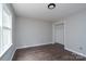 Bright bedroom featuring hardwood floors, a window, and a closet at 1013 Doby Springs Dr, Charlotte, NC 28262