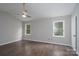 Spacious bedroom featuring neutral paint, a ceiling fan, and hardwood floors at 1013 Doby Springs Dr, Charlotte, NC 28262
