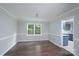 A formal dining room with beautiful molding, and hardwood floors at 1013 Doby Springs Dr, Charlotte, NC 28262
