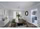 Dining room featuring a modern wood table with a decorative rug and furnishings at 1013 Doby Springs Dr, Charlotte, NC 28262