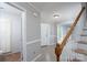 Inviting foyer featuring light hardwood floors, white trim, and an entry to the staircase at 1013 Doby Springs Dr, Charlotte, NC 28262