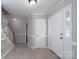 Bright foyer featuring light-colored wood floors, a staircase, and a white front door with sidelights at 1013 Doby Springs Dr, Charlotte, NC 28262