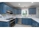 Renovated kitchen with white countertops, wooden cabinets, and stainless appliances at 1013 Doby Springs Dr, Charlotte, NC 28262