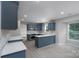 Updated kitchen showcasing gray wood cabinets and an open concept layout at 1013 Doby Springs Dr, Charlotte, NC 28262