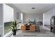 Virtually staged living room with a modern cabinet and neutral color scheme at 1013 Doby Springs Dr, Charlotte, NC 28262