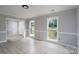 Bright living room featuring white trim, baseboards, and neutral paint at 1013 Doby Springs Dr, Charlotte, NC 28262