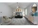 Staged main bedroom featuring a large bed, ample lighting, and neutral tones at 1013 Doby Springs Dr, Charlotte, NC 28262