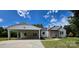 Charming single-story home featuring a carport, a manicured lawn, and inviting front porch at 1015 4Th St, Spencer, NC 28159