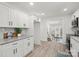 Modern kitchen with white cabinets and granite countertops at 1015 4Th St, Spencer, NC 28159