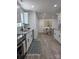 Modern kitchen with white cabinets, granite countertops, stainless steel appliances, and sleek hardware at 1015 4Th St, Spencer, NC 28159