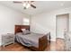 Bedroom with wood-look floors, ceiling fan, and neutral color palette at 1016 W 10Th Ave, Gastonia, NC 28052