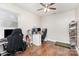 Bedroom with wood-look floors, ceiling fan, and large window for natural light at 1016 W 10Th Ave, Gastonia, NC 28052
