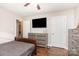 Bedroom featuring wood-look floors and access to the hallway at 1016 W 10Th Ave, Gastonia, NC 28052