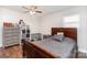 Bedroom featuring wood-look floors, ceiling fan, and natural light at 1016 W 10Th Ave, Gastonia, NC 28052