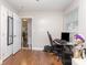 Bedroom with wood-look floors, and a view into the hallway at 1016 W 10Th Ave, Gastonia, NC 28052