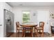 Dining area adjacent to the kitchen featuring a round table with chairs and natural light at 1016 W 10Th Ave, Gastonia, NC 28052
