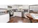 Well-lit kitchen featuring white cabinets, granite countertops, and stainless steel appliances at 1016 W 10Th Ave, Gastonia, NC 28052