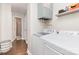 Laundry room includes modern washer and dryer, storage space, and neutral decor at 1016 W 10Th Ave, Gastonia, NC 28052
