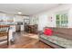 Open-concept living area with a couch and table adjacent to the kitchen at 1016 W 10Th Ave, Gastonia, NC 28052