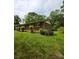 Side angle of a brick home showcasing the home's architecture and well-maintained lawn at 1105 Stanton Dr, Shelby, NC 28150