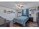 Cozy bedroom with hardwood floors, decorated walls, and a classic ceiling fan at 1107 Richard Rd, Salisbury, NC 28147