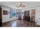 Bedroom features hardwood floor, window with blinds, and a ceiling fan with lighting at 1107 Richard Rd, Salisbury, NC 28147