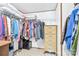 Bright walk-in closet featuring organized storage and a checkered tile floor at 1107 Richard Rd, Salisbury, NC 28147