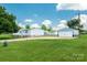 Spacious property with a well-maintained house and detached garage, surrounded by a large green lawn at 1107 Richard Rd, Salisbury, NC 28147