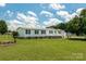 Charming single-story home with white siding, black shutters, and a well-manicured lawn at 1107 Richard Rd, Salisbury, NC 28147