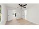 Bright bedroom featuring wood-look flooring, a ceiling fan, and doorways leading to other rooms at 1155 Cedar Grove Ln, Rock Hill, SC 29732