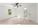 Inviting bedroom featuring a ceiling fan, natural light, an en-suite bath and light wood flooring at 1155 Cedar Grove Ln, Rock Hill, SC 29732
