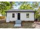 Charming home featuring white siding, a dark front door, and new landscaping for great curb appeal at 1155 Cedar Grove Ln, Rock Hill, SC 29732