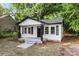 Charming home featuring white siding, black trim, and a welcoming front porch at 1155 Cedar Grove Ln, Rock Hill, SC 29732