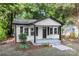 Charming home featuring white siding, black trim, and a welcoming front porch at 1155 Cedar Grove Ln, Rock Hill, SC 29732