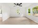 Bright living room with natural light, wood floors, ceiling fan, and neutral paint at 1155 Cedar Grove Ln, Rock Hill, SC 29732