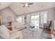Spacious living room with high ceilings, large windows, and a comfortable seating arrangement, perfect for relaxation at 11772 Sugar Hill Rd, Davidson, NC 28036