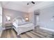 This serene main bedroom features hardwood floors, tray ceiling and neutral decor at 11772 Sugar Hill Rd, Davidson, NC 28036