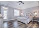 Bright bedroom boasts hardwood floors, a tray ceiling, and access to a balcony/patio at 11772 Sugar Hill Rd, Davidson, NC 28036