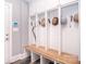 This mudroom features built-in lockers with a wooden bench, offering ample storage and seating space at 11772 Sugar Hill Rd, Davidson, NC 28036