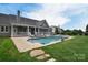 Inviting in-ground pool with lounge area and spa at 11772 Sugar Hill Rd, Davidson, NC 28036