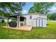 Backyard featuring patio, gazebo, shed, lush green grass, and mature trees at 118 Globe St, Mount Holly, NC 28120