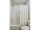 Modern bathroom featuring a tiled shower-tub combo with bronze fixtures at 118 Globe St, Mount Holly, NC 28120
