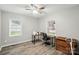 A home office or bedroom featuring wood-look floors and ample natural light at 118 Globe St, Mount Holly, NC 28120