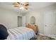 Comfortable bedroom featuring wood-look floors, a ceiling fan, and neutral colors at 118 Globe St, Mount Holly, NC 28120