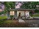 Charming home featuring a welcoming front porch, fresh landscaping, and a mix of modern and traditional design elements at 118 Globe St, Mount Holly, NC 28120